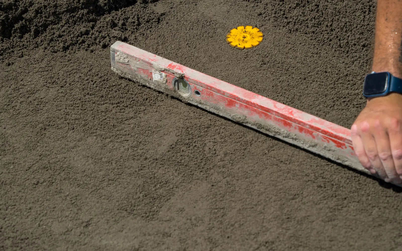 Tile installer using Screedex® platform system to build a sloped mortar bed on a tiled floor