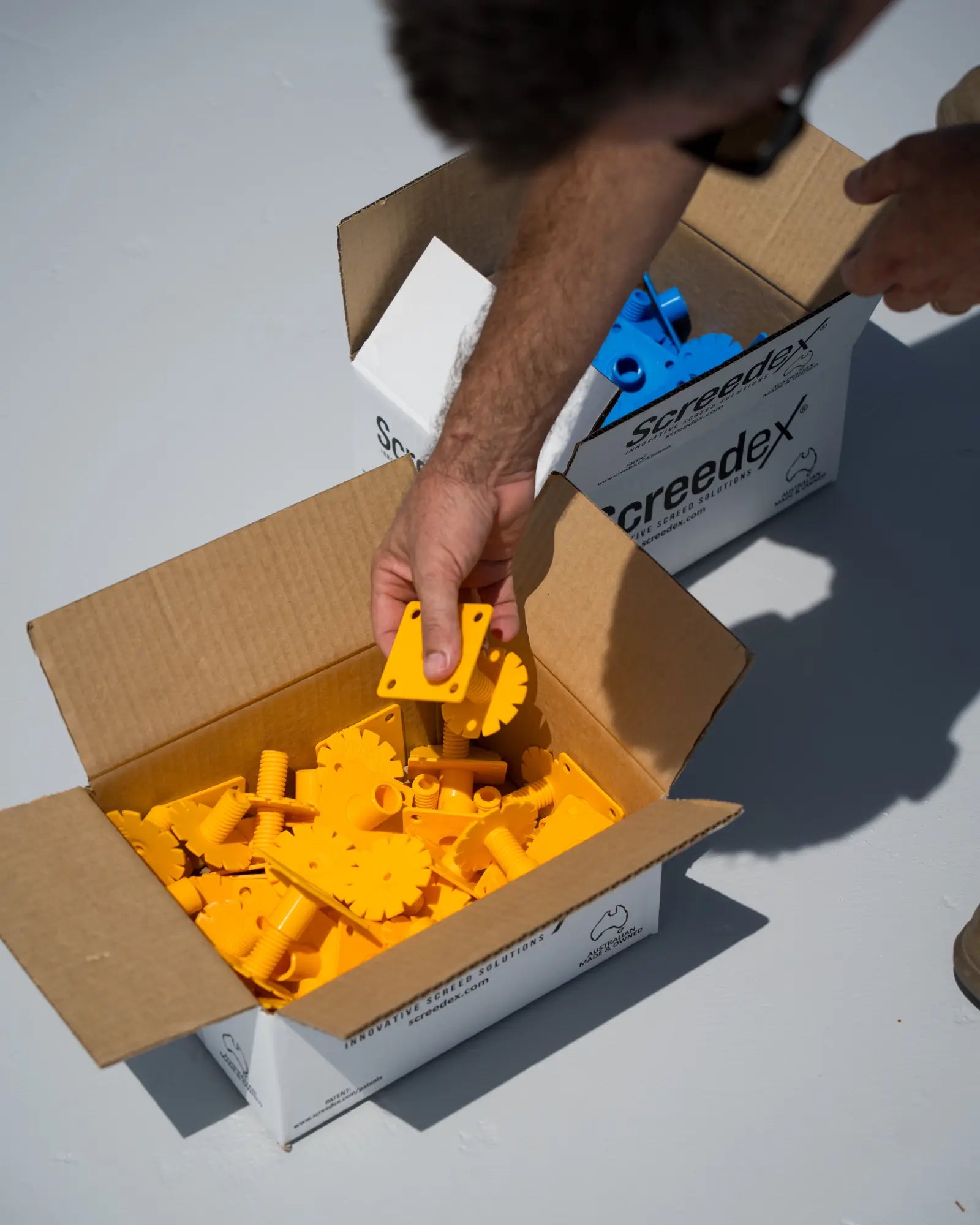 Screedex® adjustable screed platform system packaged in box for shipping to installers and DIYers