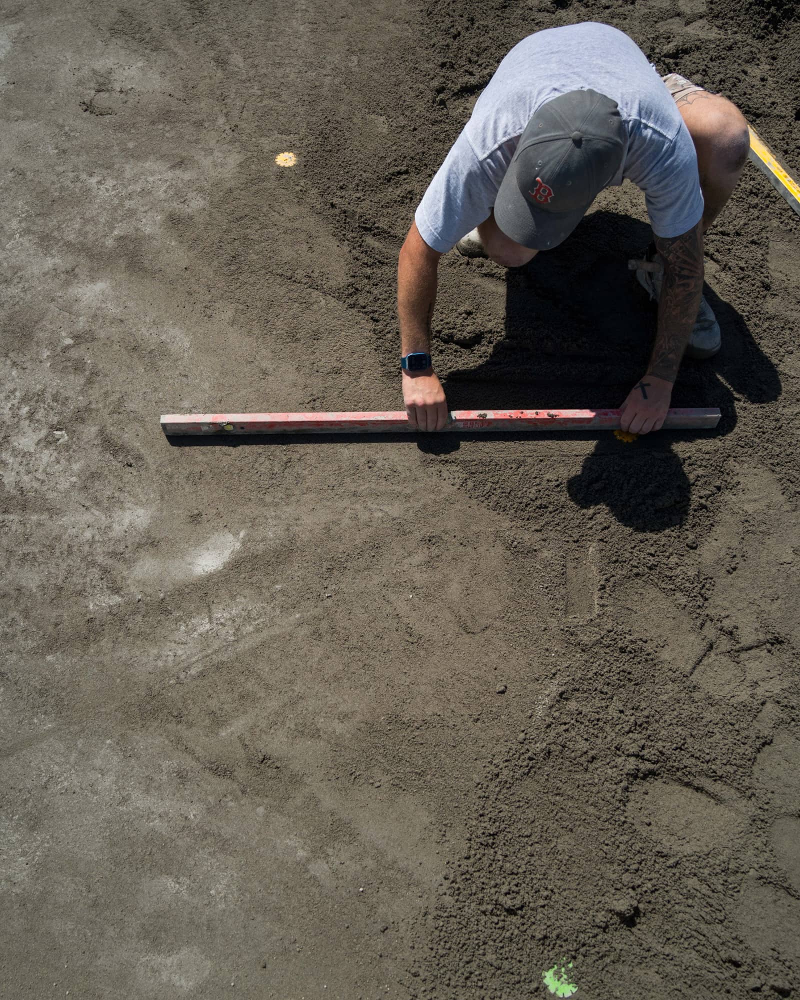 Tile installer using Screedex® Medium screed platform to level mortar bed for floor installation