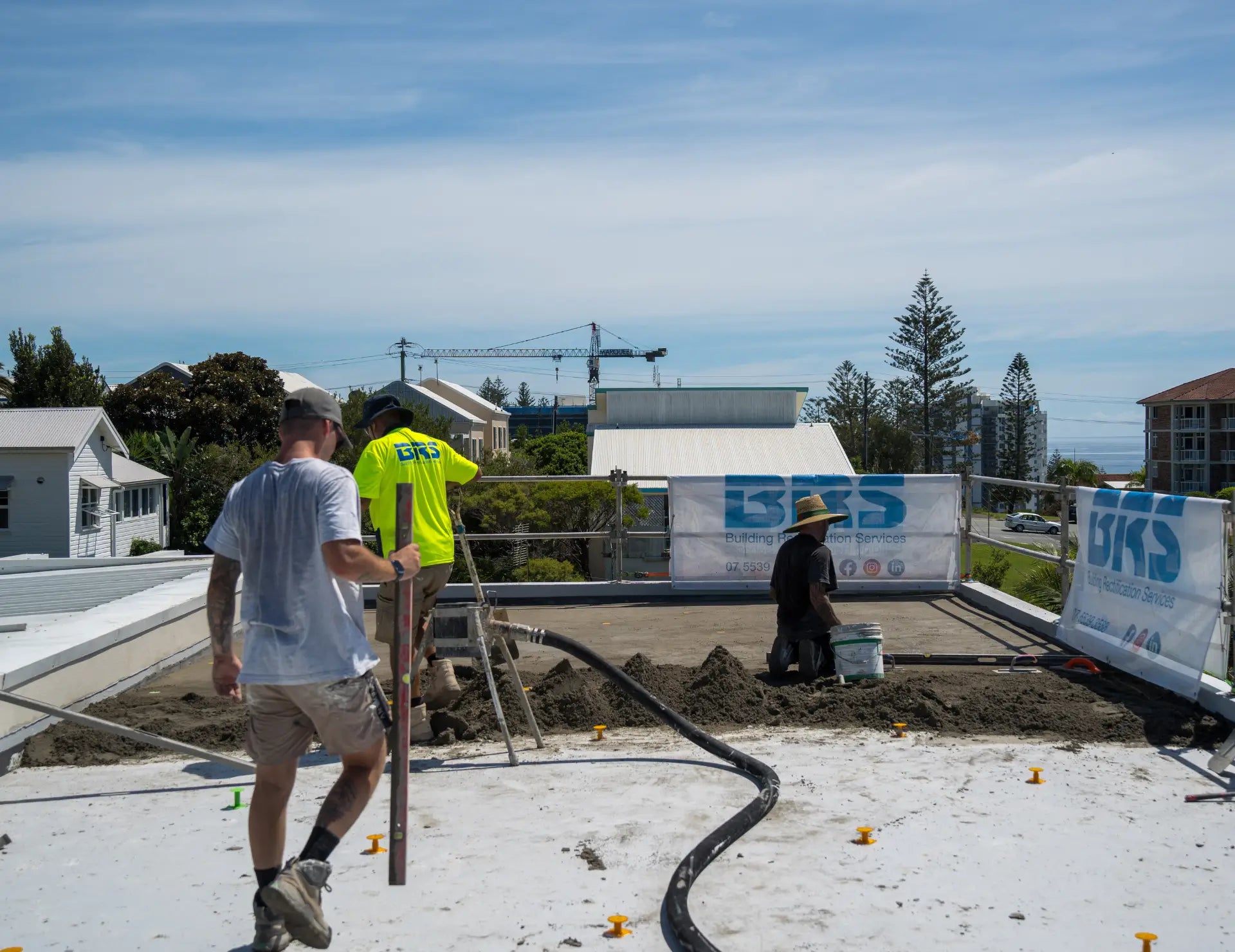 Tiling team screeding a mortar bed on-site using Screedex® floor screed platform system