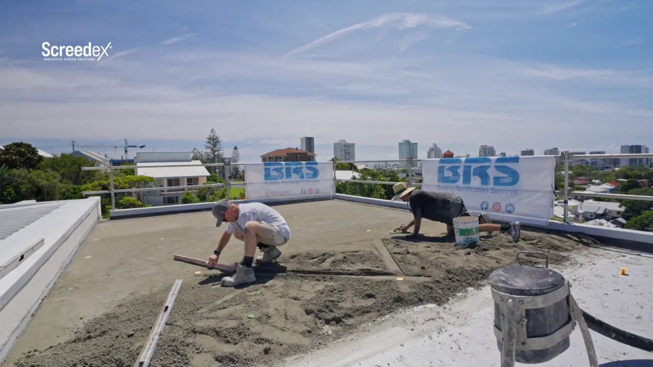 Load video: Video thumbnail showing rooftop terrace with the Screedex® platform system screeding amortar beds at different thicknesses